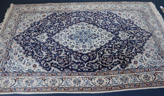 A Tabriz style cream ground rug, 255 x 158cm